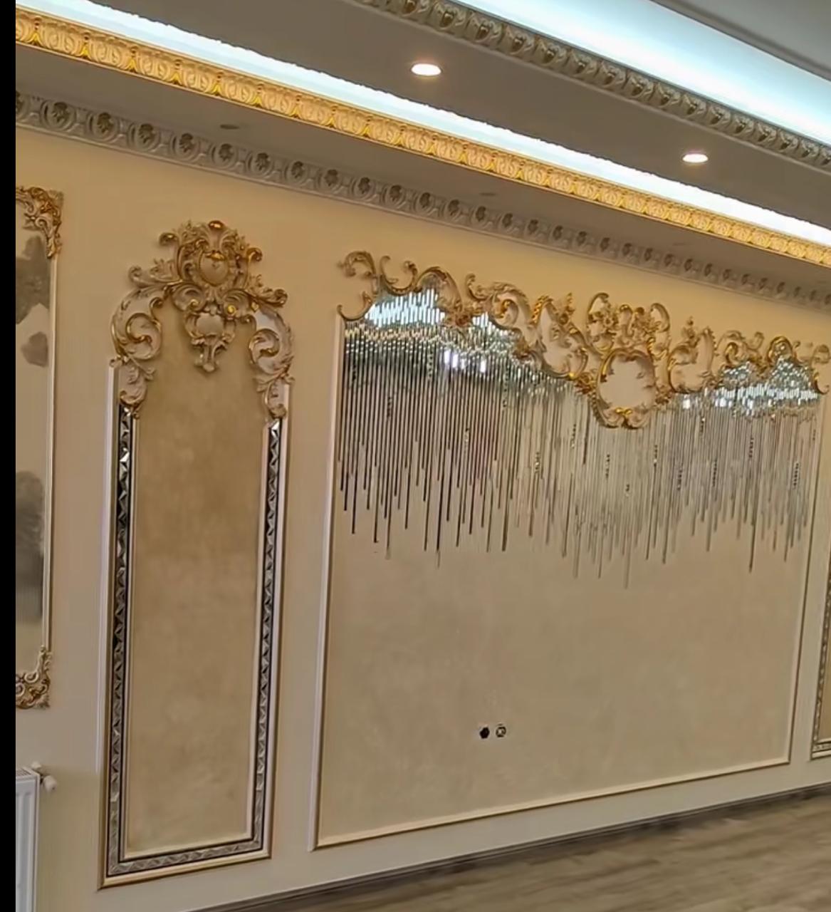 Ornamental gold ceiling cornice and wall moulding detail